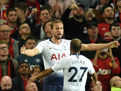 Les joueurs de Tottenham Harry Kane (g) et Lucas Moura buteurs lors de la victoire face à Manchester United 3-0 à Old Trafford le 27 août 2018 - Oli SCARFF [AFP]