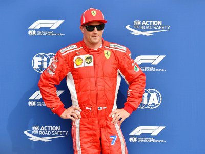 Kimi Räikkönen, sous les couleurs de Ferrari, fête sa pole position  du GP d'Italie à Monza, le 1er septembre 2018 - Andrej ISAKOVIC [AFP/Archives]