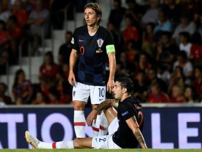 Le Croate Luka Modric (g) lors de la défaite 6-0 face à l'Espagne en 2e journée de Ligue des nations le 11 septembre 2018 - JOSE JORDAN [AFP]