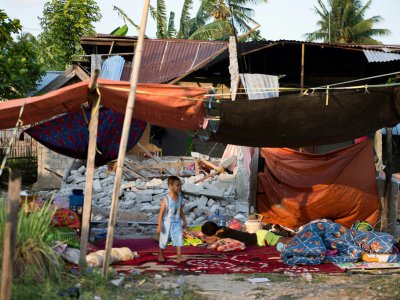 Les décombres d'une maison à Palu, dans l'île des Célèbes, après un séisme et le passage d'un tsunami, le 29 septembre 2018 - Bay ISMOYO [AFP]