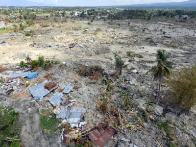 Une grande partie du quartier de Petobo, à Palu, s'est enfoncée dans la terre comme aspirée, quand les secousses telluriques ont transformé le sol en sables mouvants, un processus connu sous le nom de liquéfaction. - ADEK BERRY [AFP]