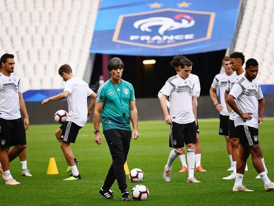 Le sélectionneur allemand Joachim Löw et ses joueurs, à l'entrainement le 15 octobre 2018 au Stade de France - Anne-Christine POUJOULAT [AFP]