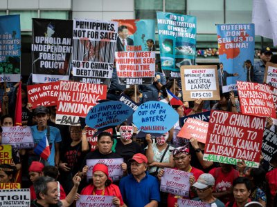 Des militants protestent contre la visite du président chinois Xi Jinping à Manille le 20 novembre 2018 - Noel CELIS [AFP]