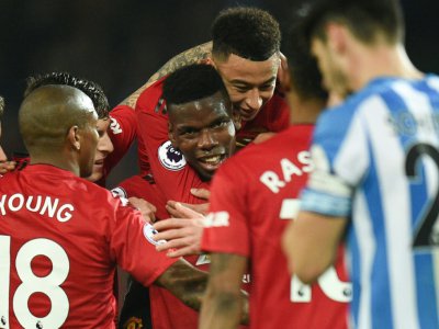 Paul Pogba fêté par ses coéquipiers avoir avoir marqué contre Huddersfield, le 26 décembre 2018 à Manchester - Oli SCARFF [AFP]