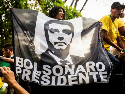 Des partisans du candidat d'extrême droite Jair Bolsonaro, le 29 septembre 2018 à Rio de Janeiro - DANIEL RAMALHO [AFP/Archives]