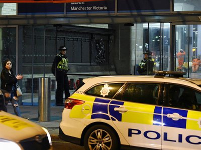 Dispositif policier à l'entrée de Victoria Station, à Manchester, le 1er janvier 2019 - Paul ELLIS [AFP]