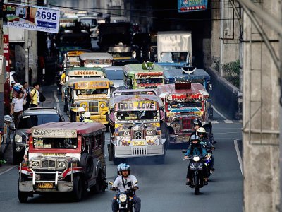 Des jeepneys dans les rues de Manille, le 17 janvier 2019 aux Philippines - Noel CELIS [AFP]