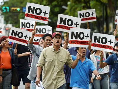 Des partisans de Juan Guaido manifestent contre Nicolas Maduro à Caracas, le 30 janvier 2019 - JUAN BARRETO [AFP/Archives]