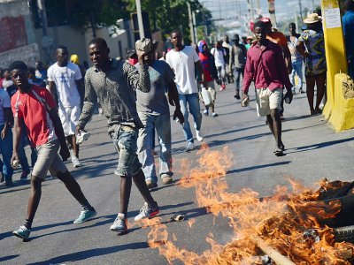 Des manifestants dans les rues de Port-au-Prince le 11 février 2019 - HECTOR RETAMAL [AFP]