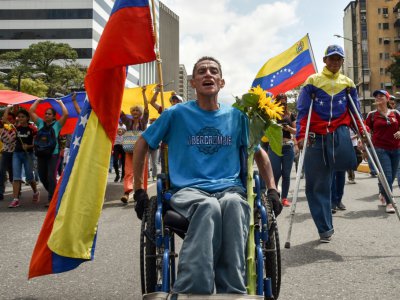 Des partisans du président autoproclamé vénézuelien Juan Guaido manifestent à Caracas le 9 mars 2019 - YURI CORTEZ [AFP]