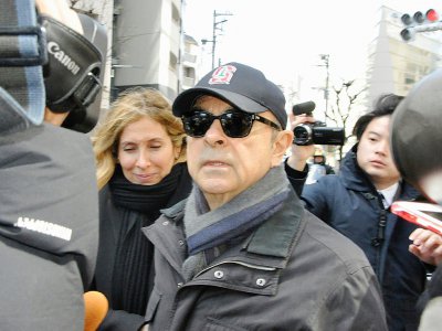 Carlos Ghosn et son épouse Carole, à Tokyo le 9 mars 2019 - JIJI PRESS [JIJI PRESS/AFP/Archives]