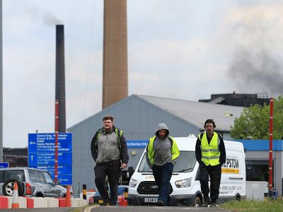 Des employés quittent l'usine British Steel de Scunthorpe, dans le nord-est de l'Angleterre, le 22 mai 2019 - Lindsey Parnaby [AFP]