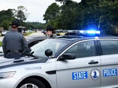 Un véhicule des "Troopers" de Virginie, près du théâtre de la tuerie de vendredi - Eric BARADAT [AFP]