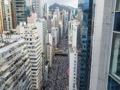 Lors de la marche du 9 juin 2019 à Hong Kong, organisée pour protester contre un projet du gouvernement local d'autoriser des extraditions vers la Chine continentale - DALE DE LA REY [AFP]