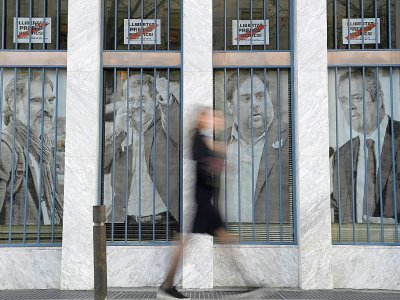Le portrait de quatre des prévenus (de g à d): Jordi Cuixart, Jordi Sanchez, Oriol Junqueras et Joaquim Forn, le 12 février 2019 à Barcelone - LLUIS GENE [AFP/Archives]