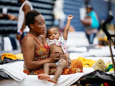 Teresa Okoma Wayemala avec Melissa, sa fille de deux ans - Johannes EISELE [AFP]