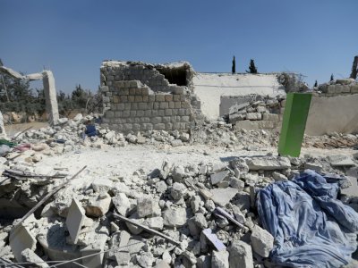 Les ruines d'un bâtiment frappé par les Etats-Unis dans la province d'Alep en Syrie le 1er juillet 2019 - Omar HAJ KADOUR [AFP]
