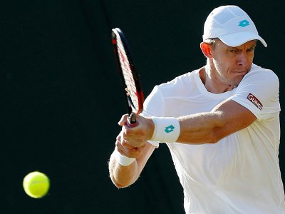 Le Sud-Africain Kevin Anderson contre le Serbe Janko Tipsarevic au 2e tour de Wimbledon, le 3 juillet 2019 - Adrian DENNIS [AFP]