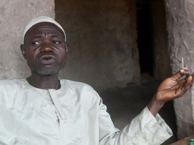 Sefiu Yusuf, président de l'association des descendants Oloola à Ibadan (sud-ouest du Nigeria), balaie les critiques sur la dangerosité de ces méthodes traditionnelles.  - PIUS UTOMI EKPEI [AFP]