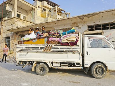 Une famille de Syriens aynt fui Khan Cheikhoun, le 14 août 2019 - Muhammad HAJ KADOUR [AFP]