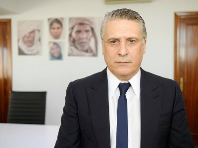 Photo d'archives de l'homme d'affaires tunisien Nabil Karoui, candidat à la présidentielle du 15 septembre, dans son bureau de Tunis le 18 juin 2019 - FETHI BELAID [AFP/Archives]
