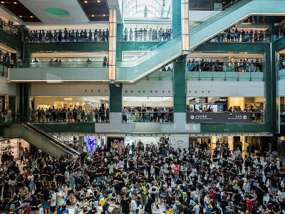 Thousands gathered inside a mall in the northern town of Sha Tin to sing protest songs and make origami cranes - ISAAC LAWRENCE [AFP]