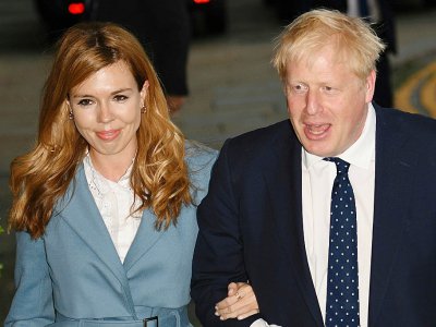 Le Premier ministre britannique Boris Johnson et sa compagne Carrie Symonds à Manchester à la veille du congrès du Parti conservateur, le 28 septembre 2019 - Oli SCARFF [AFP]