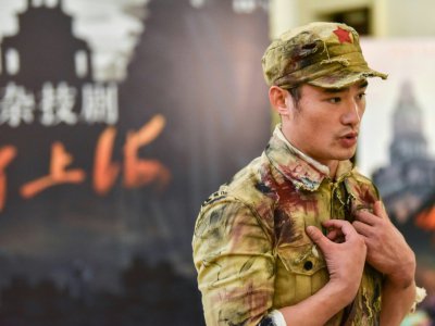 Wang Huaifu, acteur principal du spectacle baptisé "La bataille de Shanghai" - STR [AFP]