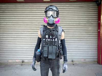 Frontline protesters often wear helmets, goggles and respirators - NICOLAS ASFOURI [AFP]