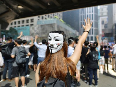Rassemblement contre une loi d'urgence interdisant le port du masque lors de manifestations, le 4 octobre 2019 à Hong Kong - Nicolas ASFOURI [AFP]