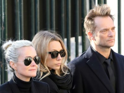 Laeticia Hallyday, Laura Smet et David Hallyday (de G à D) lors des funérailles de Johnny Hallyday à l'église de la Madeleine à Paris le 9 décembre 2017 - ludovic MARIN [AFP/Archives]