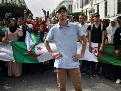 Ait Said Abdenour, un jeune manifestant à Alger, le 22 octobre 2019. - RYAD KRAMDI [AFP]