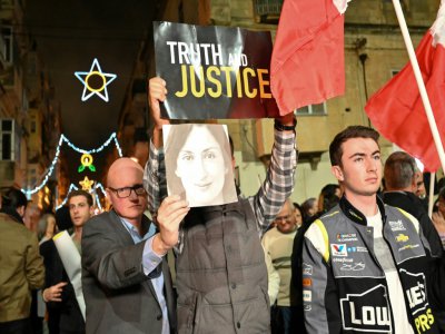 Appel à la justice après l'assassinat d'une journaliste à Malte, devant le quartier général de la police à La Valette, le 3 décembre 2019 - ANDREAS SOLARO [AFP]
