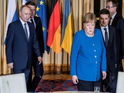 Le président russe Vladimir Poutine et la chancelière allemande Angela Merkel lors d'une réunion sur l'Ukraine à l'Elysée à Paris le 9 décembre 2019 - Christophe PETIT TESSON [POOL/AFP/Archives]