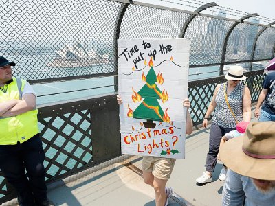 Des manifestants exigent des mesures pour lutter contre le réchauffement climatique, le 21 décembre 2019 à Sydney - Wendell TEODORO [ZEDUCE/AFP]