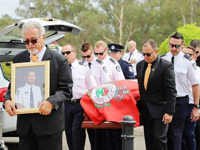 Cérémonie de funérailles d'Andrew O'Dwyer (photo dans le cadre), un pompier de 36 ans décédé en combattant les feux fin décembre, le 7 janvier 2020 à Sydney - Handout [New South Wales Rural Fire Service/AFP]
