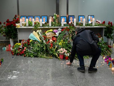 Hommage à l'aéroport de Boryspil près de Kiev le 8 janvier 2020 pour les victimes du crash à Téhéran de l'Ukraine International Airlines - Sergei SUPINSKY [AFP]