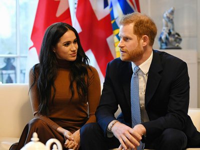 Le prince Harry (d) et son épouse Meghan à Londres, le 7 janvier 2020 - DANIEL LEAL-OLIVAS [POOL/AFP]