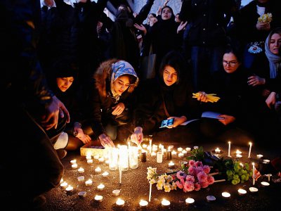 Des Iraniens rendent hommage aux victimes tuées dans l'avion ukrainien abattu par les forces armées iraniennes, lors d'une manifestation à Téhéran le 11 janvier 2020 - - [AFP]