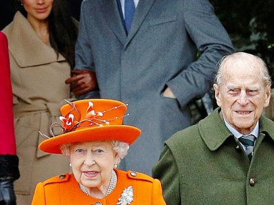 (ARCHIVES) Le prince Harry et Meghan, alors sa fiancée, avec la reine Elizabeth et le prince Philip à la sortie de la messe de Noël à  Sandringham (est de l'Angletere), le 25 décemvre 2017 - Adrian DENNIS [AFP/Archives]