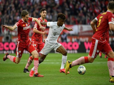L'attaquant français du Bayern Munich, Kingsley Coman  (c), lors du match de Bundesliga à Cologne, le 16 février 2020 - INA FASSBENDER [AFP]