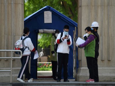 Reprise des cours pour les lycéens le 27 avril 2020 à Pékin - GREG BAKER [AFP]