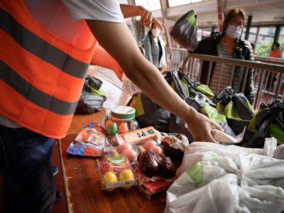 Distribution alimentaire à Genève, le 9 mai 2020 - Fabrice COFFRINI [AFP]