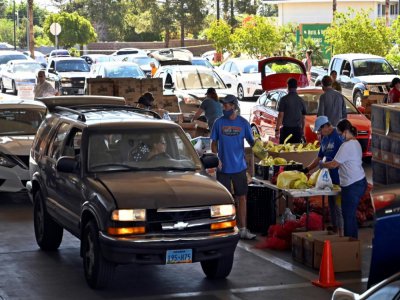 Distribution de nourriture 
dans un parking à Las Vegas, le 29 avril 2020 pour ceux qui ont perdu leur emploi du fait de la crise sanitaire - David Becker [AFP/Archives]
