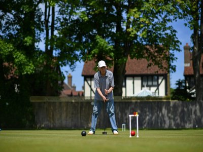 A player in action at Sussex County Croquet Club on England's south coast - Ben STANSALL [AFP]