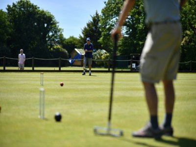 Players in action at Sussex County Croquet Club on the south coast of England - Ben STANSALL [AFP]