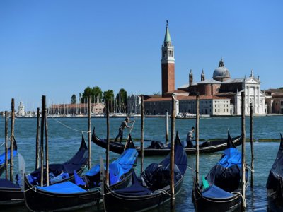 Des gondoliers à Venise, le 27 mai 2020 - MIGUEL MEDINA [AFP]