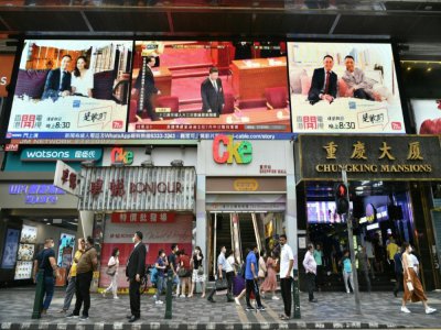Retransmission sur un écran géant à Hong Kong, du président chinois Xi Jinping lors de l'Assemblée nationale populaire à Pekin, le 28 mai 2020 - Anthony WALLACE [AFP]