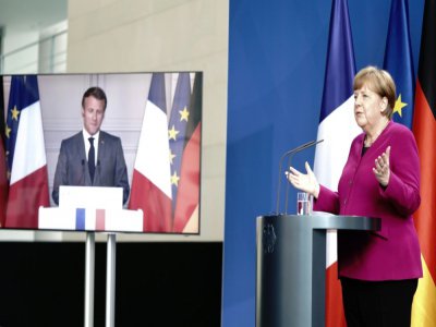 La chancelière allemande Angela Merkel et le président français Emmanuel Macron, lors d'une conférence de presse à Berlin, le 18 mai 2020 - Kay NIETFELD [POOL/AFP]