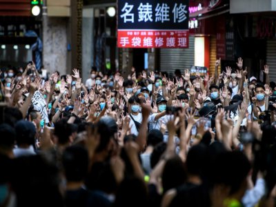 Des manifestants contre la loi de sécurité nationale à Hong Kong, le 1er juillet 2020 - Anthony WALLACE [AFP]